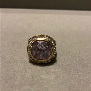 Elegant Gold and Silver Ring with Purple Gemstone